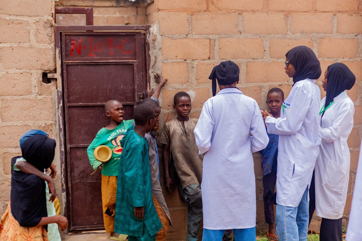A diverse healthcare team supporting an organized community health program in Kenya