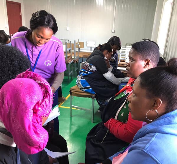 Participants receiving guidance at an institutional health session